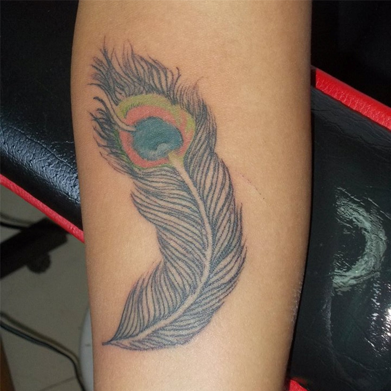 Elegant Peacock Feather Tattoos